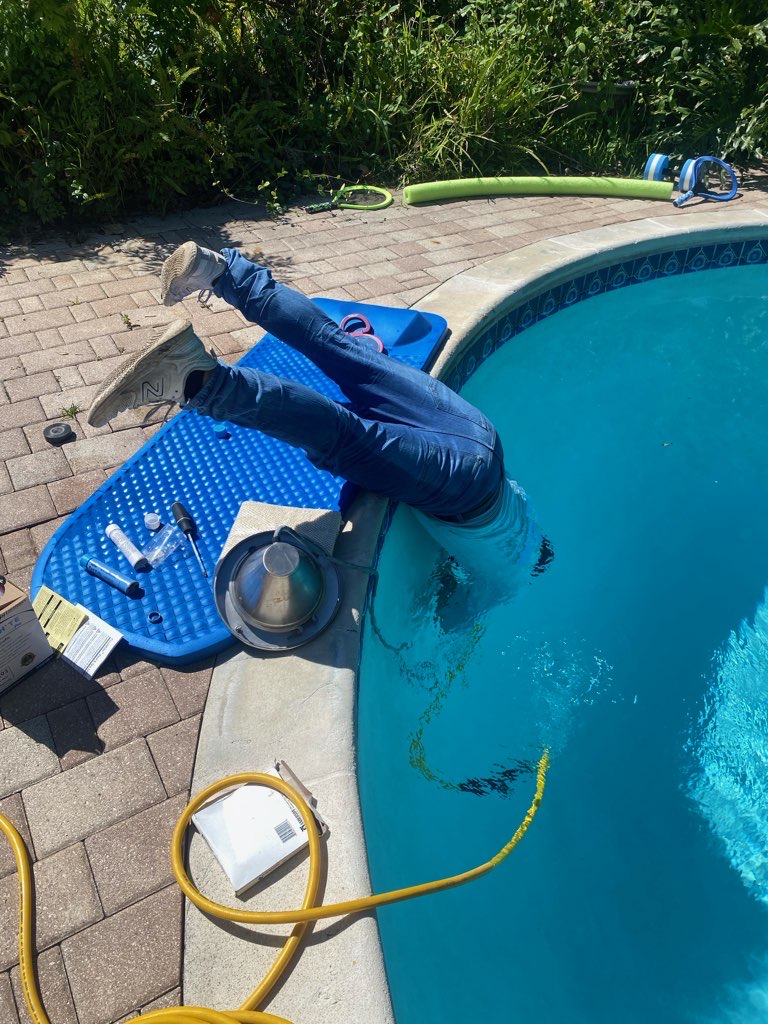 Commercial Aquaworx technician servicing a pool