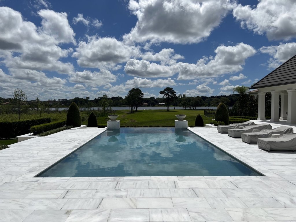 Luxury estate pool and patio maintained by Commercial Aquaworx