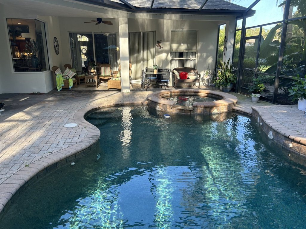 Luxury home pool with clear blue water serviced by Commercial Aquaworx